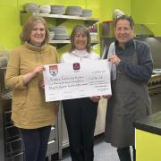 Bridport 2023 ladies captain Carolyn McAllister present Bridport Community Kitchen with the cheque
