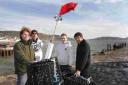 FLYING THE FLAG: Launching the Lyme Bay Experimental Potting Project at Lyme Regis are fishermen Alex Jones, David Moncraff, and Nigel Marsh, and Plymouth University PhD student Adam Rees