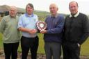 WINTER WIN: Phil Dowell, centre left, receives the Winter Shield from veterans’ vice-chairman Keith Brown alongside runners-up Richard Fox, left, and Richard Lomax, right
