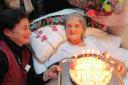 PARTY: Queenie Hodge celebrates her 103rd birthday  at Coneygar Lodge with  staff member Louisa Roper