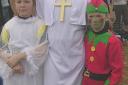 WINNING SMILE: Fancy dress winner Austin Slade, as the Pope, with daughters Honor ,10, and Imogen, 9