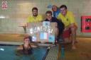 Anne Stone with family and lifeguards to mark the final length of her 22-mile  challenge