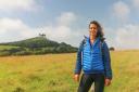 Pictured: Julia Bradbury on her Golden Cap walk with Colmer's Hill in the background