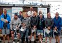 Henry Wetherell, back centre, took the OK Dinghy world title at Lyme Regis