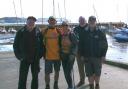 Antony and Sally Brown with Lyme Regis RNLI crew members John Cable, Nick Marks and John Bird