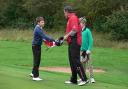 HANDY SCORE: Adam Harris shakes hands with Ryder Cup ace Lee Westwood
