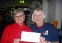 Sandy West from ASDA and Mary Bates for MNDA West Dorset with the cheque for £200