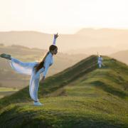 BYD student Lucie dancing in the landscape of Eggardon a hill fort in West Dorset. (Photo: Brendan Buesnel)