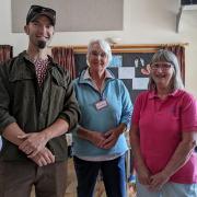 Rose Mock, president of the Uplyme and Lyme Regis Horticultural Society (centre) with Jim Johnson-Hills of Woodroffe School Gardening Club (left) and Rachel Jordan, trustee of Flamingo Community Pool (right).