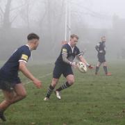 Sam Petchey, centre, scored the winning penalty for Bridport in a thriller with Wheatsheaf