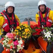 Last year's blessing of the boats showing lifeboat crew members Andy Butterfield and Elliott Herbert with wreaths