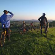 Cyclists on Eype Down which is above West Bay.