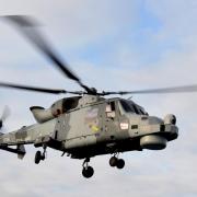 The Royal Navy helicopter was seen over West Bay