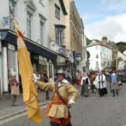 Members of the Taunton Garrison marching through the streets of Lyme Regis as they re-enact the siege of 1664