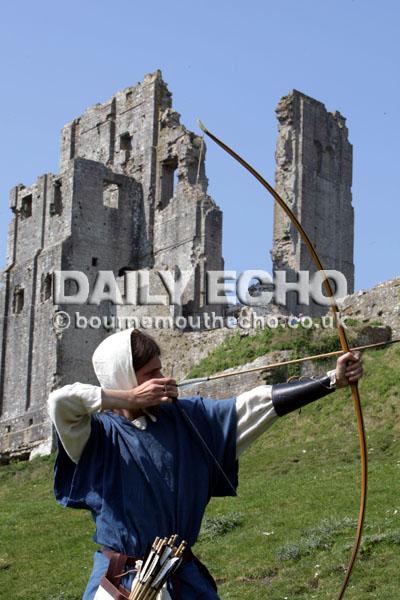 Members of the Wolves Head Bowmen put on an Archery display at Corfe Castle. 
