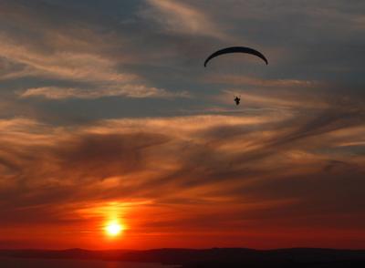 St Aldheims Head, just outside Worth Matravers. Jeremy Calderwood paragliding at sunset. Taken by Cay Hickson.
