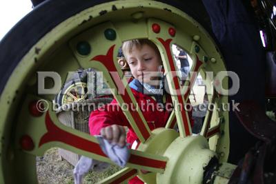 The Great Dorset Steam Fair   at Tarrant Hinton.  Neo Naylor , 7  helping with the cleaning.