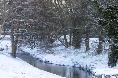 Snow hits Bridport area.  A snowy scene of the River Asker. 