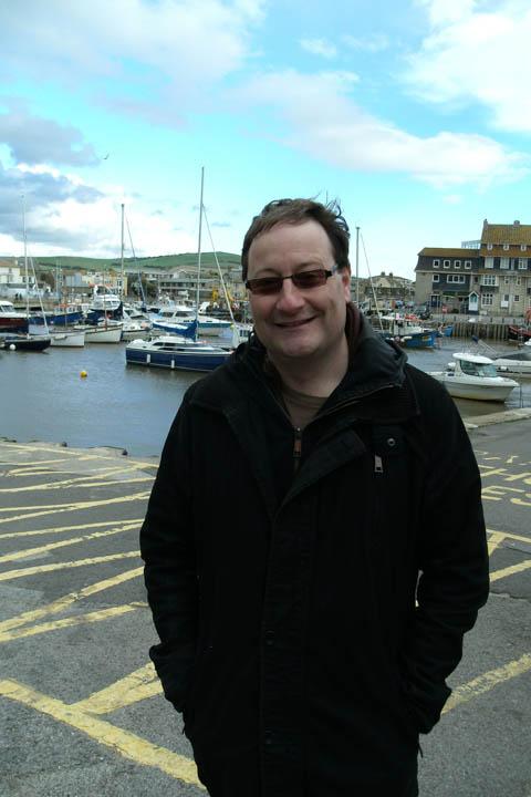 Broadchurch writer and Bridport resident Chris Chibnall at West Bay during filming. Pic: Anne Bell