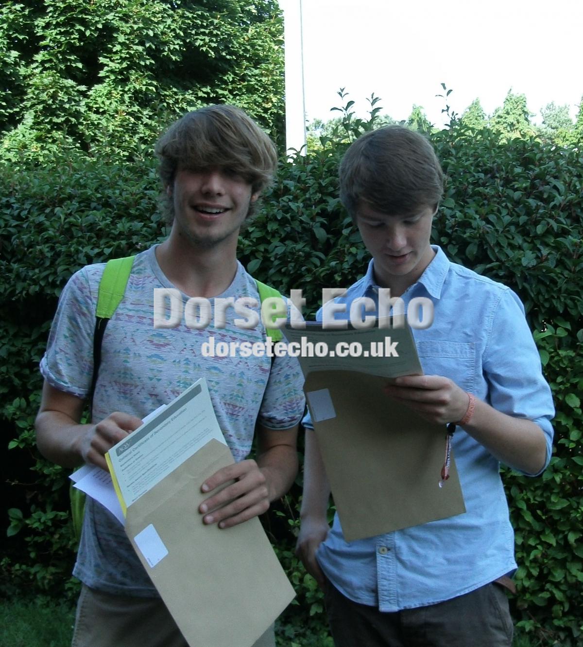 GCSE results August 22, 2013.
Sir John Colfox School, Bridport
Photo: Anne Bell
 Cary Allard left and Chris Durow open their results envelope.