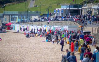 Customers fill the seafront at eat: Lyme Regis 2023