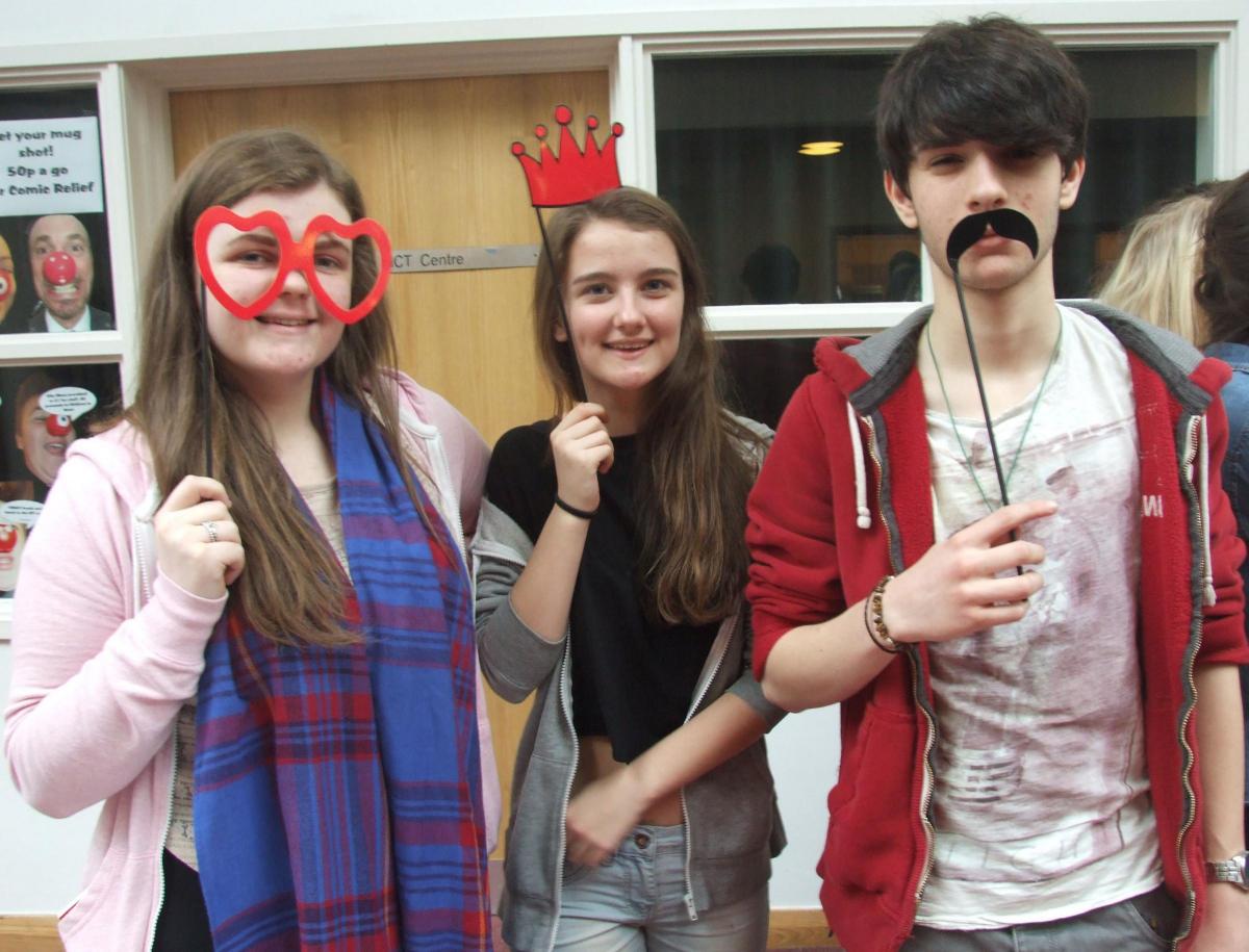 Pupils at Colfox School make their faces funny for Red Nose Day 2015.