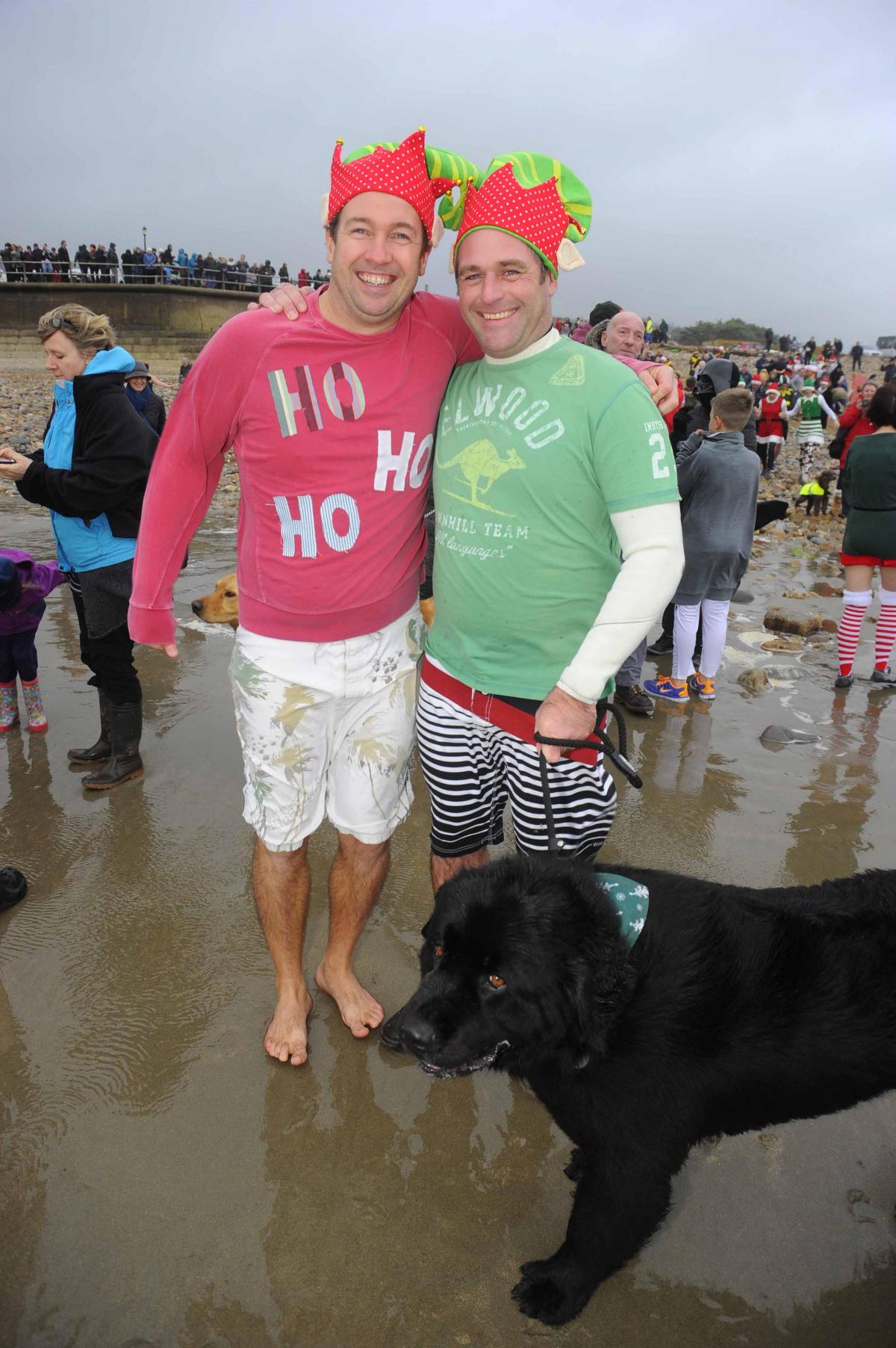 Mike Ferguson, Graham Newton and Balthazar the dog at the Charmouth Christmas Day Swim 2015 Picture: Graham Hunt Photography