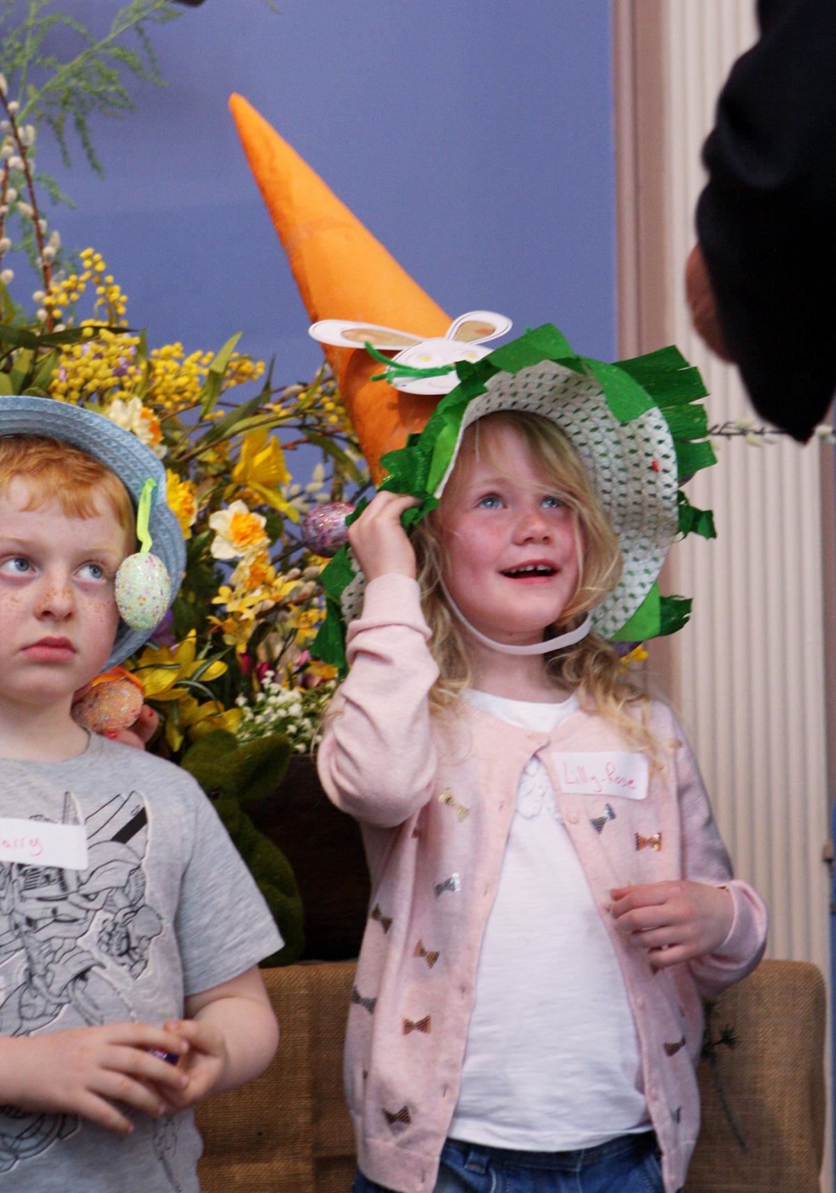 Lily-Rose Howse is awarded her prize in the Easter bonnet competition Picture: MAISIE HILL