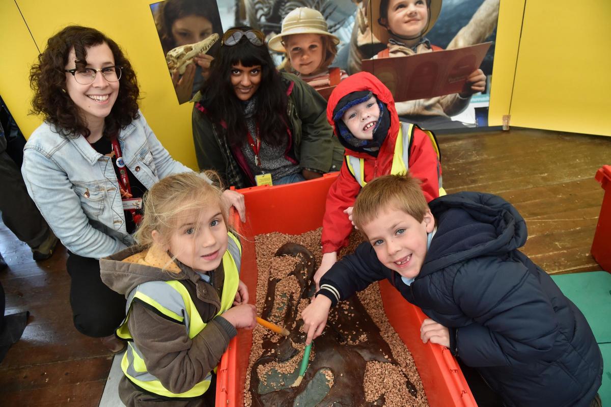 Natural History Museum staff help Loders School pupils uncover a fossil. Picture:JOHN GURD JG17646.