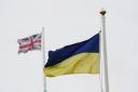 The Ukraine and UK flags fly side by side