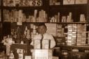 Don Dampier behind the counter of Charmouth Stores in 1950