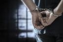 Man in handcuffs. Stock image
