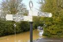 A flood alert is in place for west Dorset rivers. Pictured,  the River Bride burst its banks in October 2023