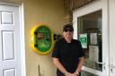 Chris Chantler, Chair of Vernon's Court Residents Association with the new defibrillator at Vernon's Court