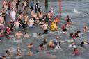 Last year's West Bay Wallow sees hundreds swimming in the West Bay harbour