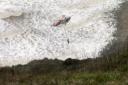 Three rescued by helicopter after being cut off by tide