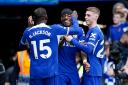 Noni Madueke (centre) is congratulated by Cole Palmer (right) after he set up Chelsea’s fourth goal for Nicolas Jackson (left) on Sunday (Zac Goodwin/PA)