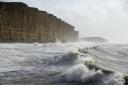 Waves crash in at West Bay by Finnbarr Webster