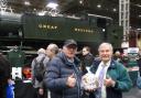 Douglas Beazer presenting Pete Waterman with the Dorset apple cake at the NEC on Saturday