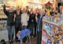 Volunteers at the RNLI shop in Lyme Regis celebrating their success of the past year