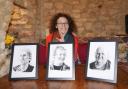 Sasha Slater with portraits of, from left,  Chris Sewell, John Eggleton and Tony Hawkins