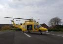 Dorset and Somerset Air Ambulance helicopter on the helipad at Dorset County Hospital