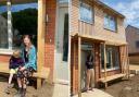 A new eco-friendly development in Bridport has welcomed its first residents.