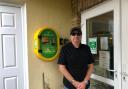 Chris Chantler, Chair of Vernon's Court Residents Association with the new defibrillator at Vernon's Court