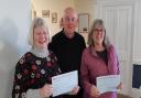 Cheques being presented by the Chairman of the Lodge, David Craddock to Mrs Judith Hanson and Mrs Helen Smith