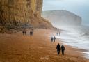People walking under the cliff just days after the rockfall