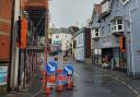 Scaffolding and temporary traffic lights are in place on Bridge Street in Lyme Regis