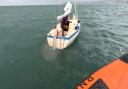 Lyme Regis RNLI inshore lifeboat approaching Mayday yacht
