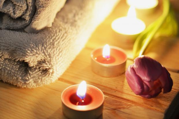 Bridport and Lyme Regis News: A pile of towels, candles and a tulip. Credit: Canva