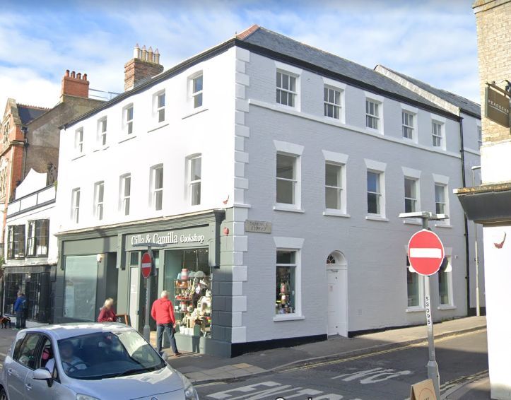 Corner building at East Street/Downes Street, Bridport. The existing shop fronts will remain in place   (Google Maps)